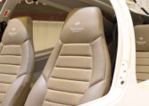 Diamond Aircraft cockpit interior with tan leather seats and stitching detail in light aircraft cabin.