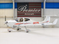White single-engine light aircraft N627PS in Premier Aircraft hangar, side view with T-tail and propeller, for sale