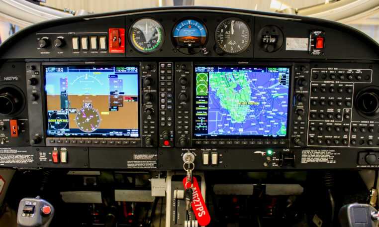 Airplane cockpit instrument panel with Garmin glass avionics, dual displays and GPS navigation map