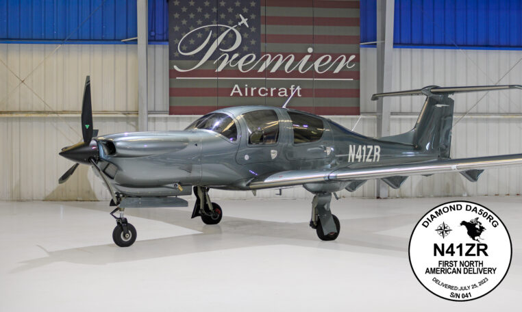 Diamond DA50 RG N41ZR in Premier Aircraft hangar, sleek gray single-engine prop plane, first North American delivery.