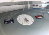 Airplane wing fuel cap with Jet A-1 warning and labels: 24 gal usable, 25.5 gal total capacity, close-up in hangar.