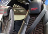 Diamond DA50 RG aircraft interior: black leather seats with red stitching and honeycomb pattern, cockpit seatbelt detail