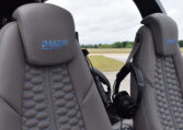 Diamond DA50 RG cockpit with gray leather seats and headset, luxury light aircraft interior on runway