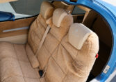 Diamond Aircraft sheepskin rear seats inside blue single-engine airplane interior, tan upholstery and seatbelts