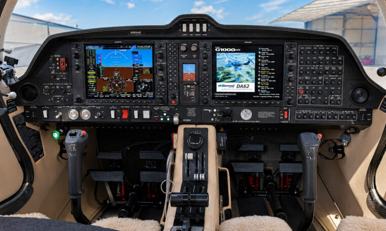 Diamond DA62 cockpit with Garmin G1000 NXi avionics, dual control sticks and throttle quadrant, twin-engine aircraft