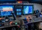 Modern Piper aircraft cockpit with dual yokes, Garmin glass avionics displays, GPS map and flight instruments.