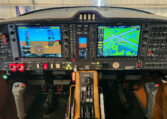 Modern light aircraft glass cockpit with dual Garmin G1000 displays, instrument panel and throttle quadrant.